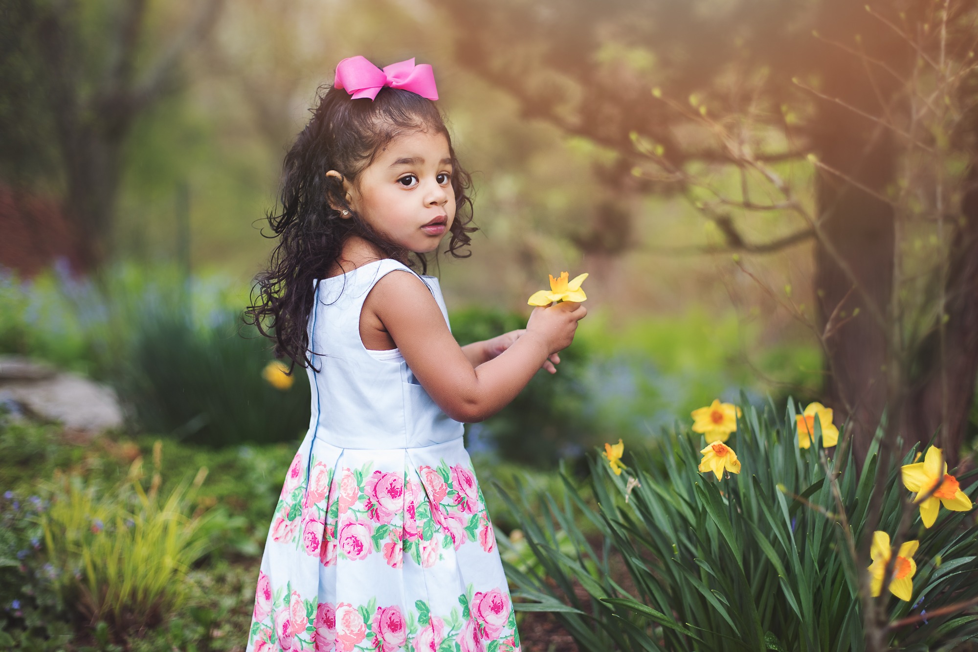 Two year old with flowers
