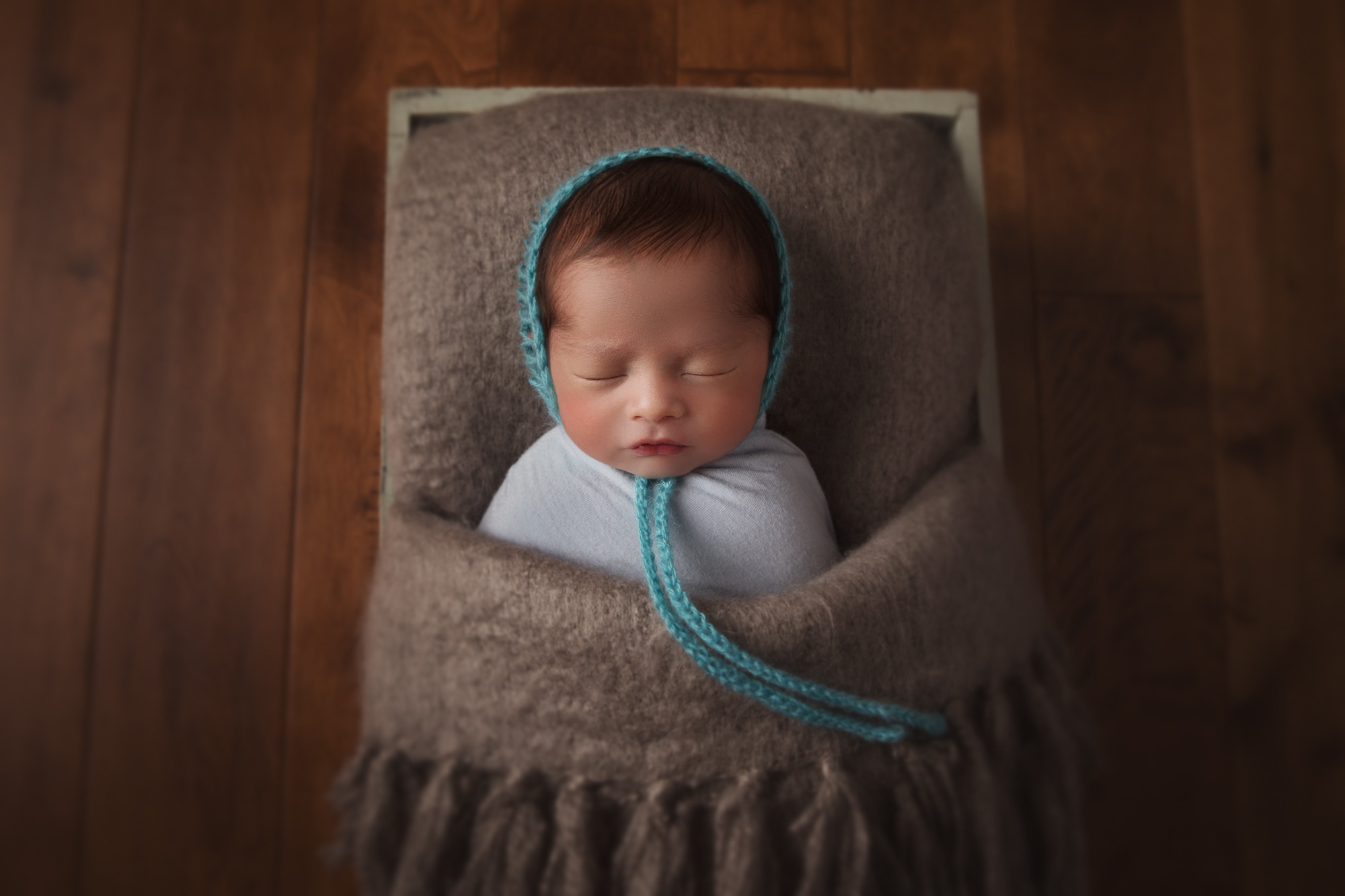 Artistic newborn photography with props